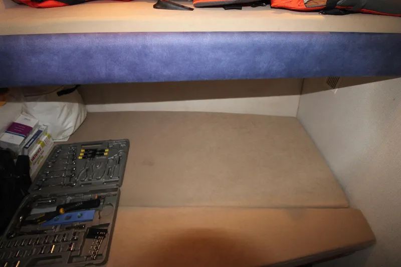 Slide: The Image of Interior of a 1995 Carver 370 Voyager with tools and storage space. - 20