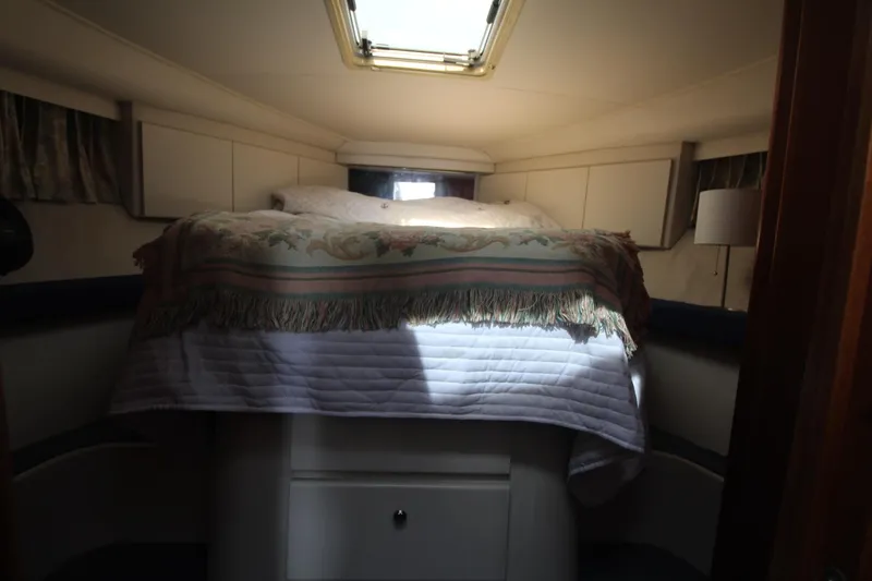 Slide: The Image of Cozy cabin interior of 1995 Carver 370 Voyager with bed and natural light. - 21