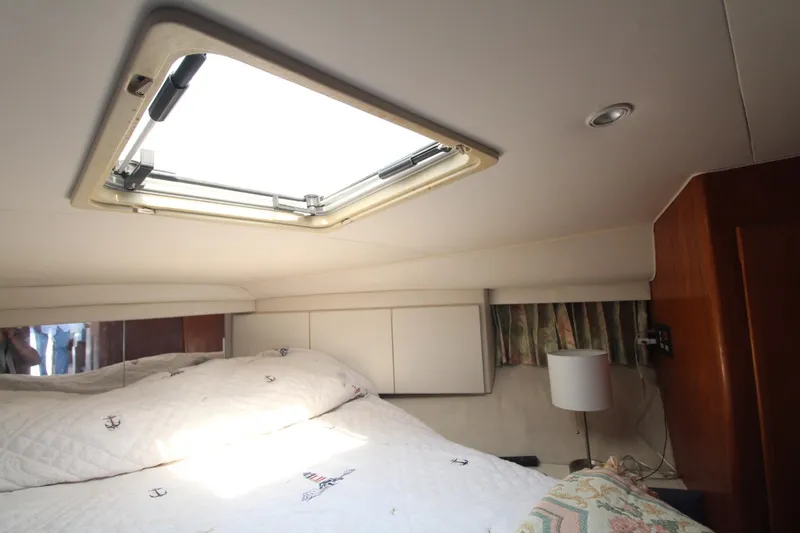 Slide: The Image of Cozy cabin interior of 1995 Carver 370 Voyager with skylight and bed. - 24