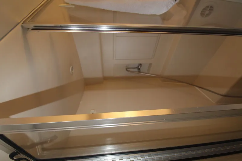 Slide: The Image of Shower area inside 1995 Carver 370 Voyager yacht, featuring glass door and modern fixtures. - 29