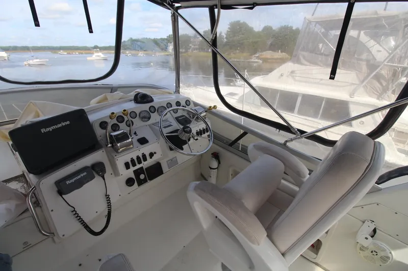 Slide: The Image of Interior view of 1995 Carver 370 Voyager boat cockpit with steering wheel and navigation equipment. - 4