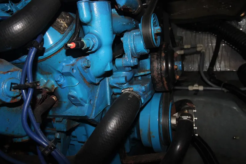 Slide: The Image of Close-up of a 1995 Carver 370 Voyager engine with blue components and black hoses. - 43