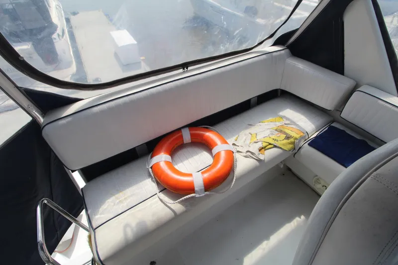 Slide: The Image of Interior of 1995 Carver 370 Voyager with life preserver on white seating. - 5