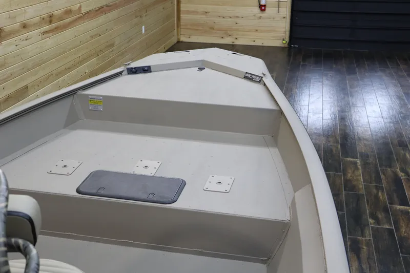 Slide: The Image of 2025 War Eagle 2170 Blackhawk boat interior in wooden showroom. - 18