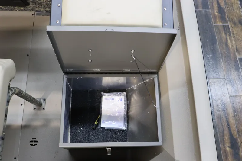 Slide: The Image of Open storage compartment in 2025 War Eagle 2170 Blackhawk boat interior. - 20