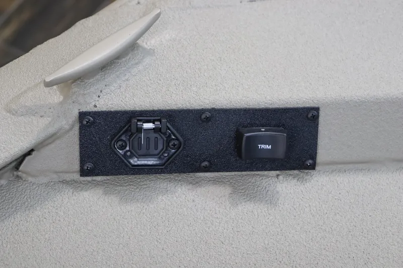 Slide: The Image of 2025 War Eagle 2170 Blackhawk boat trim switch and power outlet panel. - 26