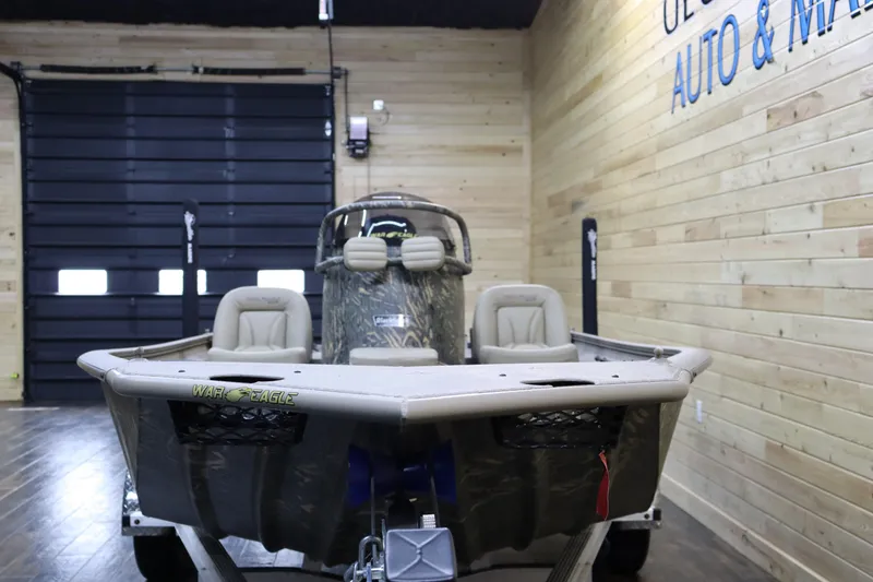 Slide: The Image of 2025 War Eagle 2170 Blackhawk boat in showroom, front view. - 7