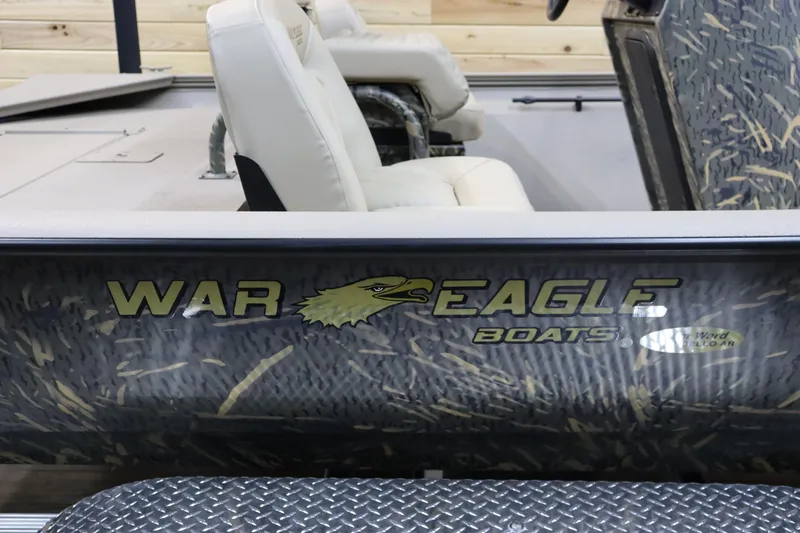 Slide: The Image of 2025 War Eagle 2170 Blackhawk boat with camo design and comfortable seating. - 8