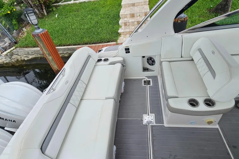 Slide: The Image of 2022 Regal 33 XO boat interior with white seating and deck view. - 17