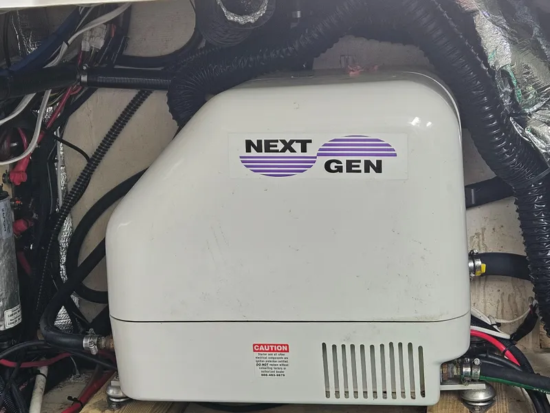 Slide: The Image of Next Gen generator in 2022 Regal 33 XO boat engine compartment. - 22