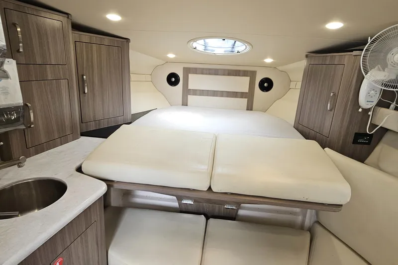 Slide: The Image of Luxurious 2022 Regal 33 XO cabin interior with modern amenities and comfortable seating. - 25