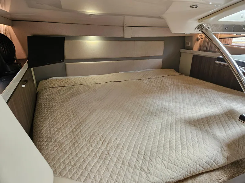 Slide: The Image of Luxurious interior cabin of 2022 Regal 33 XO yacht with spacious bed. - 27