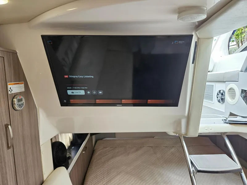 Slide: The Image of Interior of 2022 Regal 33 XO boat with mounted TV screen. - 28
