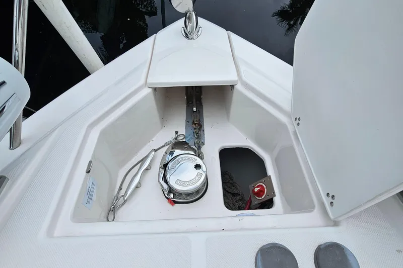Slide: The Image of Anchor compartment of 2022 Regal 33 XO boat with chain and winch. - 4
