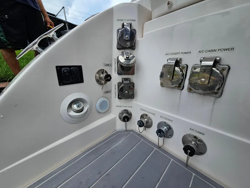 Slide: The Image of Control panel of a 2022 Regal 33 XO boat with various switches and outlets. - 6