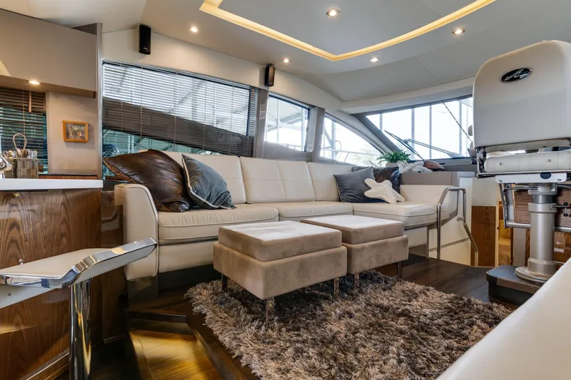 Slide: The Image of Luxurious interior of 2018 Sea Ray L550 Fly yacht with plush seating and modern decor. - 38