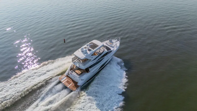 Slide: The Image of Aerial view of 2018 Sea Ray L550 Fly yacht cruising on open water. - 9