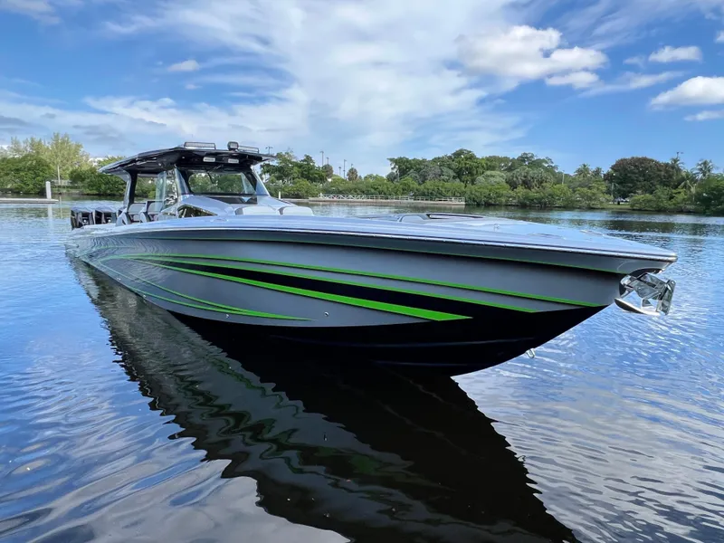 Slide: The Image of 2024 Nor-Tech 500 Sport boat with sleek design on calm water. - 10