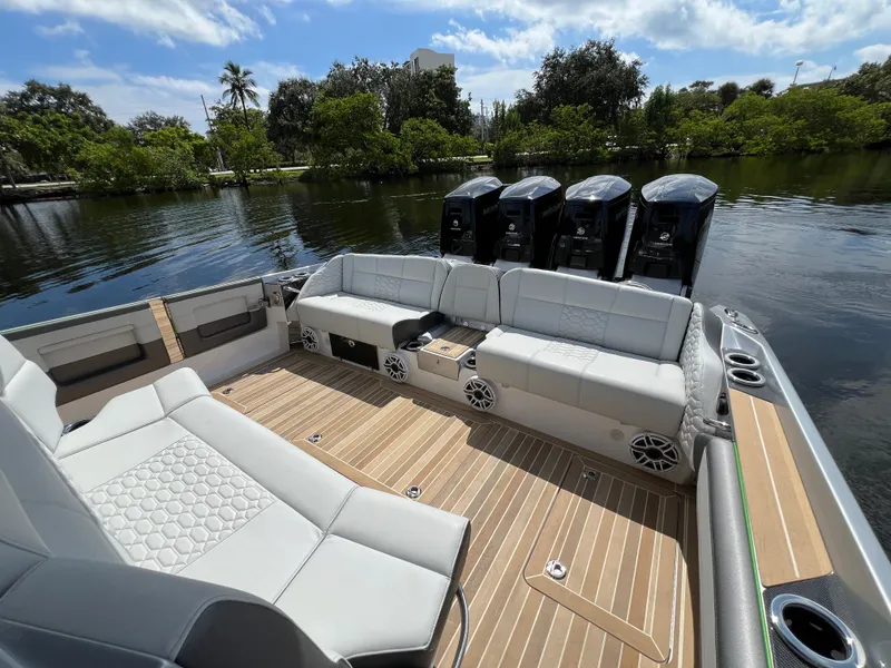 Slide: The Image of 2024 Nor-Tech 500 Sport boat interior with luxurious seating and powerful engines. - 11