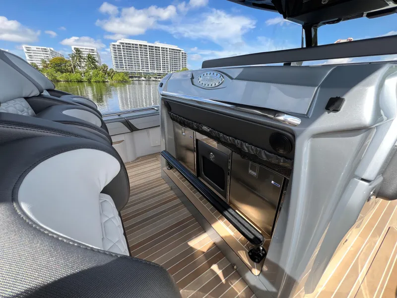 Slide: The Image of 2024 Nor-Tech 500 Sport boat interior with luxurious seating and modern amenities. - 19