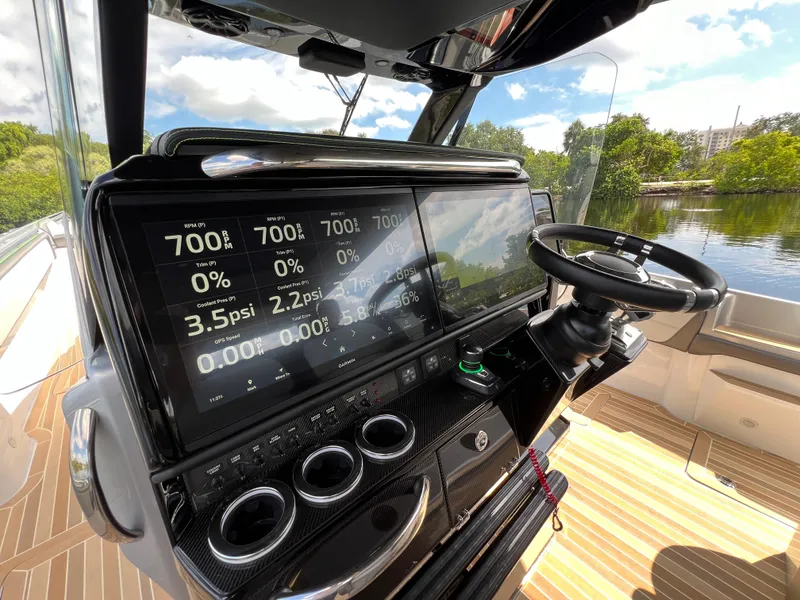 Slide: The Image of 2024 Nor-Tech 500 Sport dashboard with advanced digital displays and steering wheel. - 23
