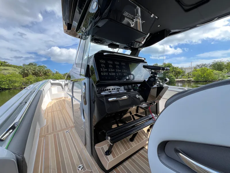 Slide: The Image of 2024 Nor-Tech 500 Sport boat interior with sleek dashboard and modern controls. - 27