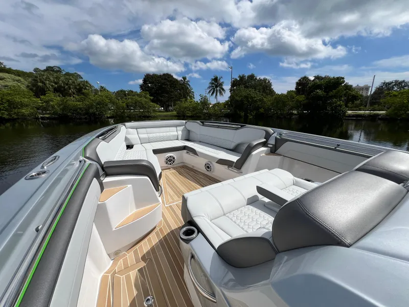 Slide: The Image of Luxurious 2024 Nor-Tech 500 Sport boat interior with plush seating and scenic water view. - 28
