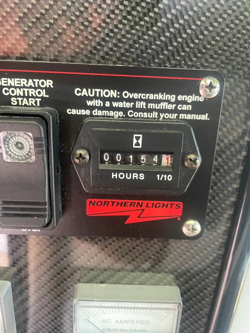 Slide: The Image of 2024 Nor-Tech 500 Sport generator control panel with hour meter reading 154.1 hours. - 35