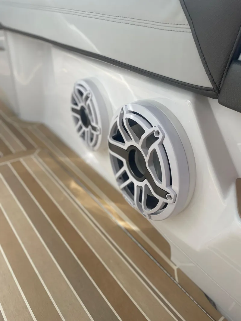 Slide: The Image of 2024 Nor-Tech 500 Sport boat speakers on sleek wooden deck. - 36