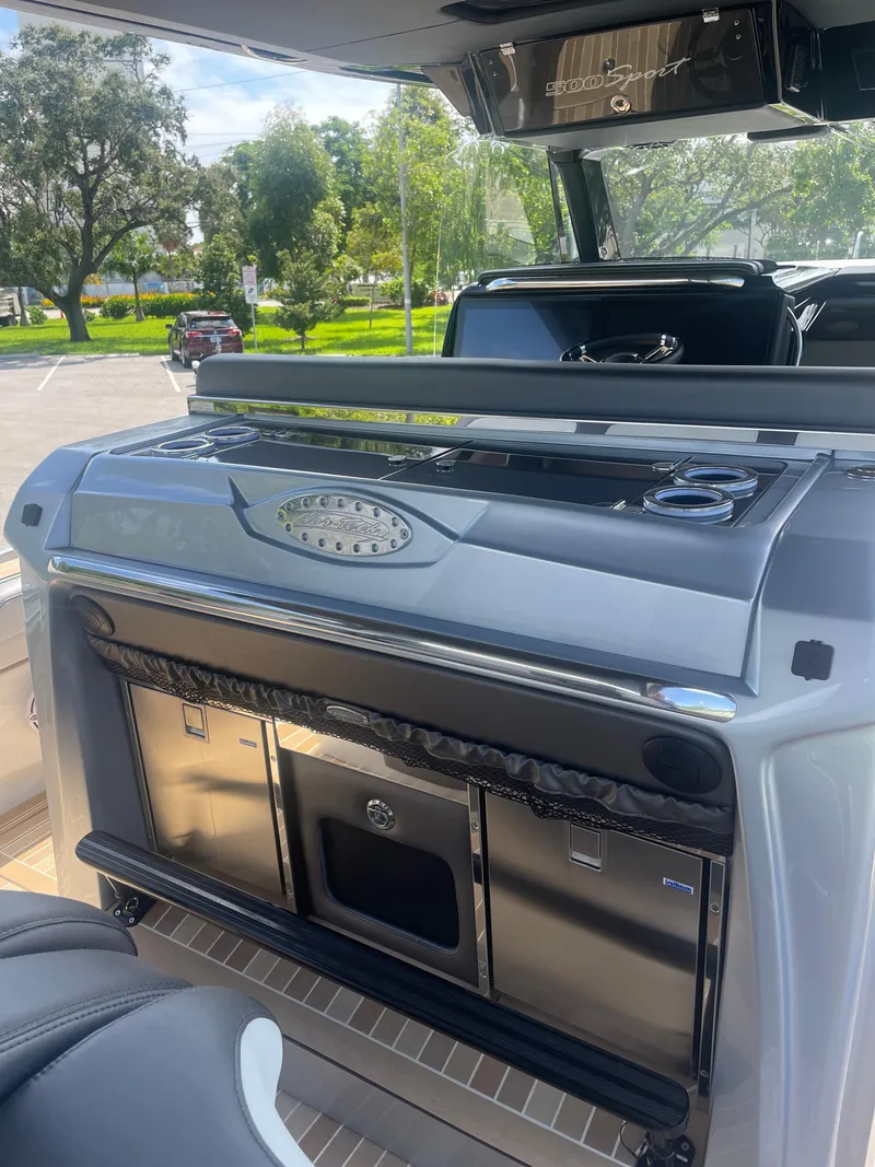 Slide: The Image of 2024 Nor-Tech 500 Sport boat interior with sleek kitchen amenities. - 38