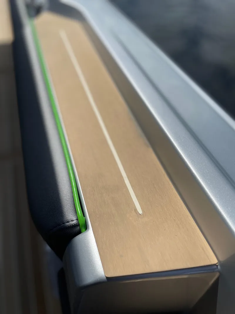 Slide: The Image of Close-up of 2024 Nor-Tech 500 Sport boat's sleek, modern deck design. - 39