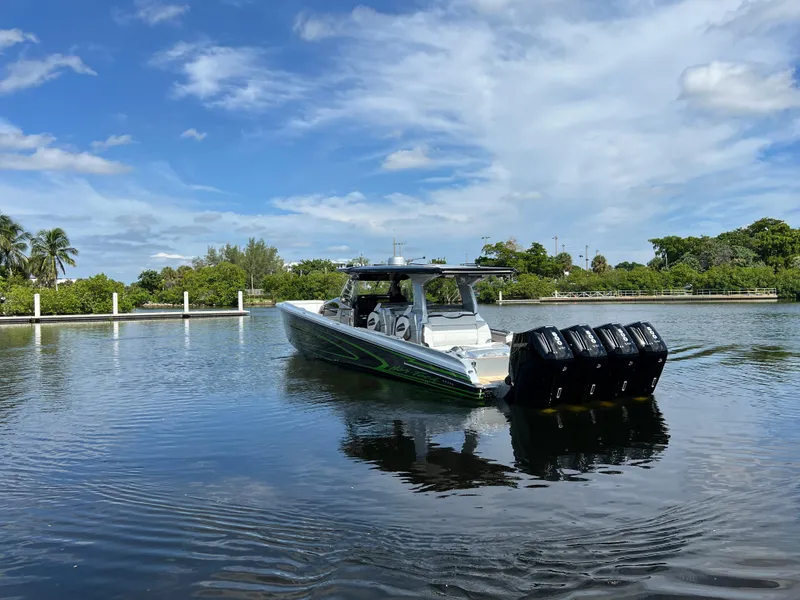 Slide: The Image of 2024 Nor-Tech 500 Sport boat on calm water under a blue sky. - 4