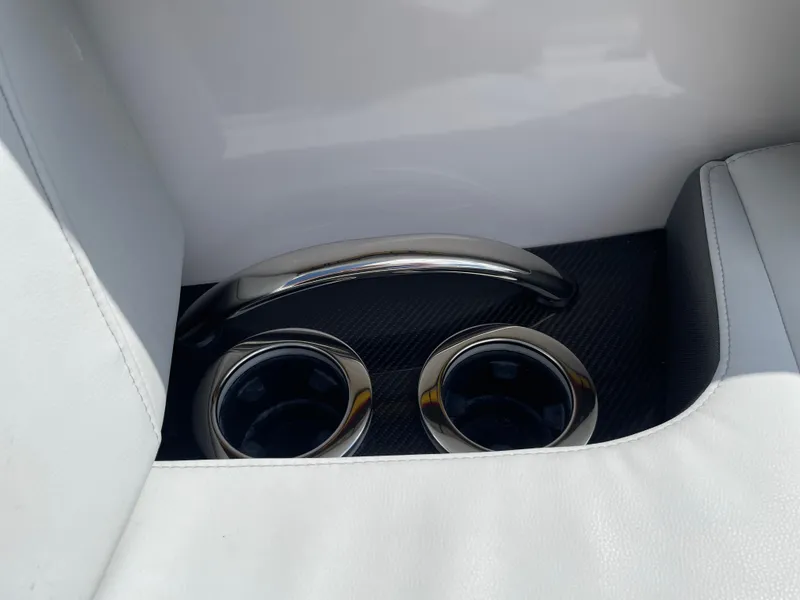 Slide: The Image of 2024 Nor-Tech 500 Sport interior with sleek cup holders and chrome handle. - 40