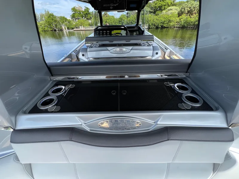 Slide: The Image of 2024 Nor-Tech 500 Sport boat interior with sleek design and cup holders. - 41