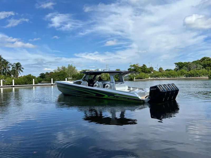 Slide: The Image of 2024 Nor-Tech 500 Sport boat on calm water under a blue sky. - 5
