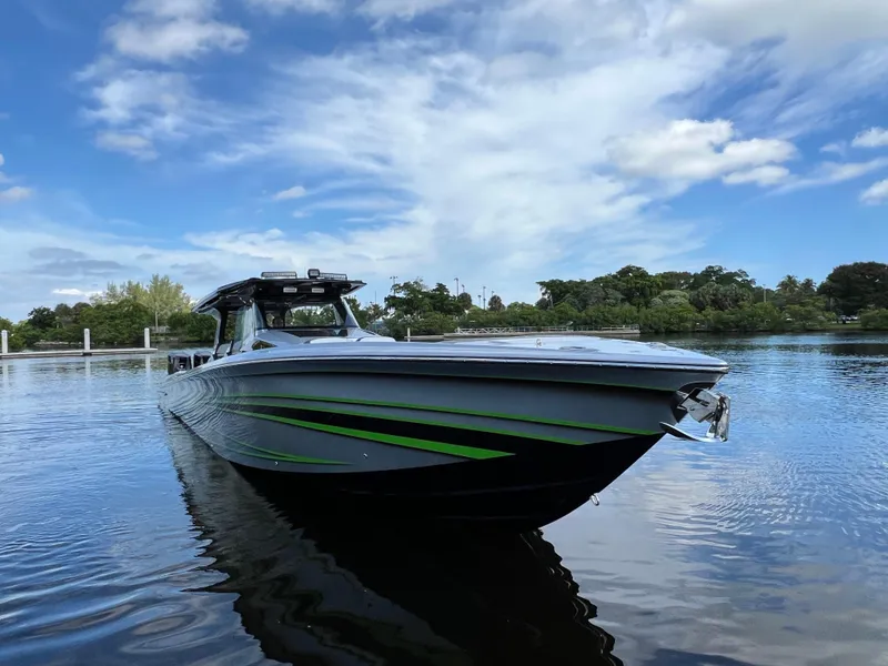 Slide: The Image of 2024 Nor-Tech 500 Sport boat on calm water under a blue sky. - 9