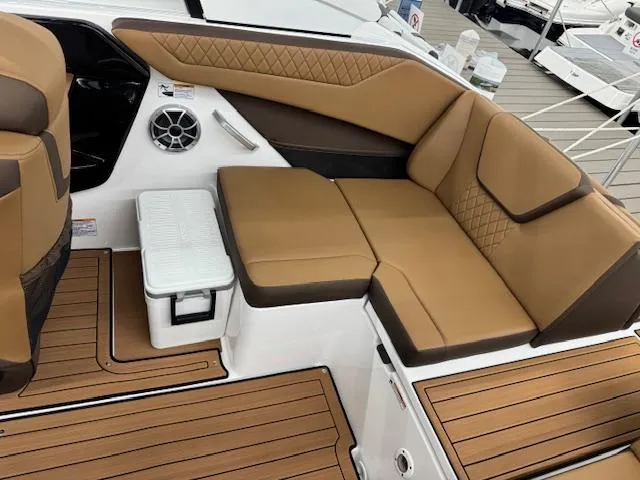 Slide: The Image of 2025 Yamaha Boats 222S interior with tan seating and teak flooring. - 13
