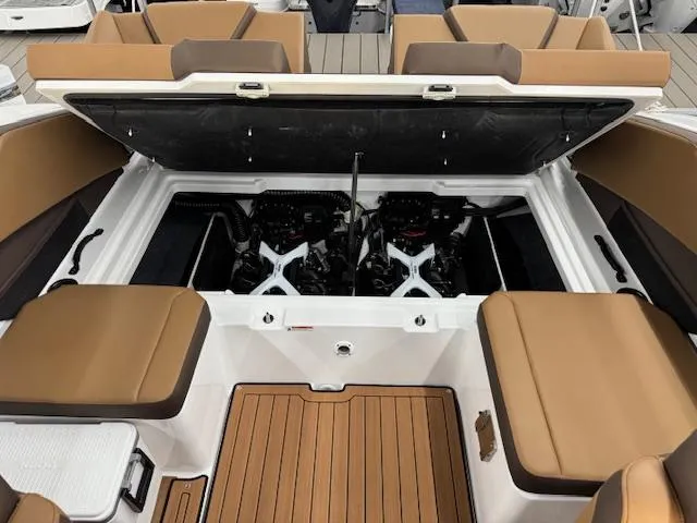 Slide: The Image of 2025 Yamaha Boats 222S engine compartment with seating and storage area. - 14