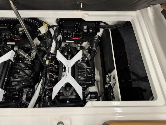 Slide: The Image of Engine compartment of a 2025 Yamaha Boats 222S, showcasing dual engines and mechanical components. - 16