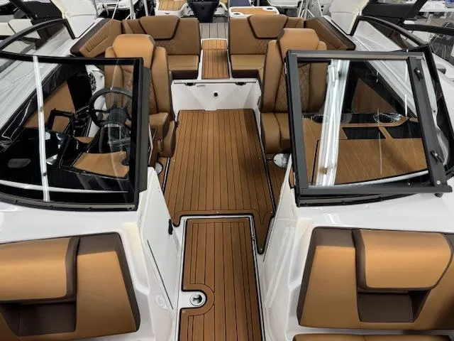 Slide: The Image of 2025 Yamaha Boats 222S interior with tan seating and sleek design. - 3