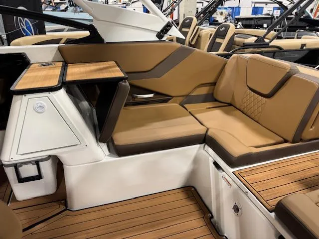 Slide: The Image of 2025 Yamaha Boats 252SE interior with tan seating and wood accents. - 15