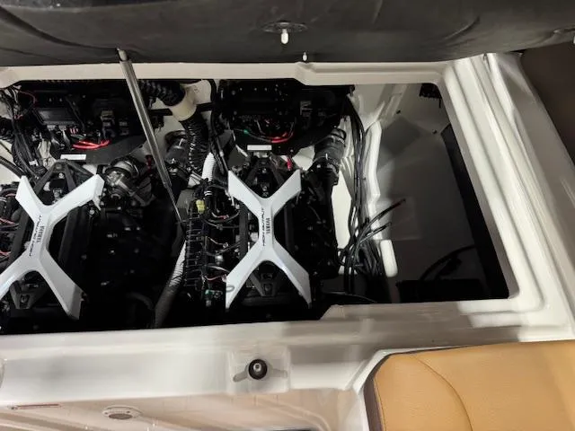 Slide: The Image of Engine compartment of 2025 Yamaha Boats 252SE, showcasing dual engines and wiring. - 18
