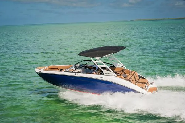 Slide: The Image of 2025 Yamaha Boats 252SE cruising on clear turquoise water. - 23
