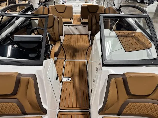 Slide: The Image of 2025 Yamaha Boats 252SE interior with tan leather seats and wood accents. - 4