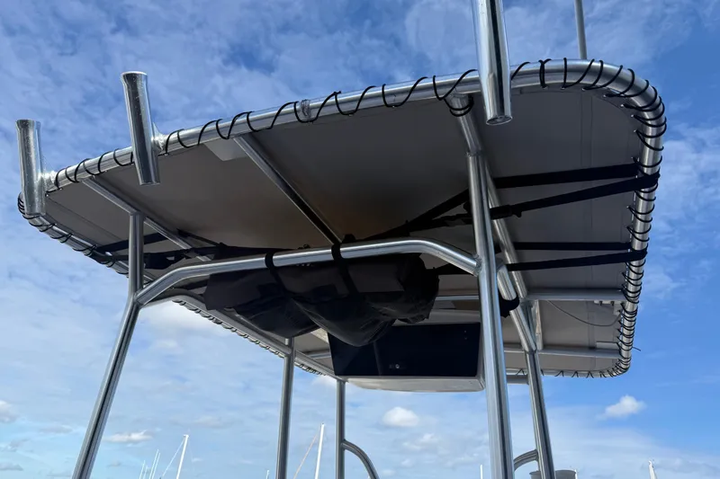 Slide: The Image of 2006 Pro-Line 21 Sport boat T-top against a blue sky background. - 13