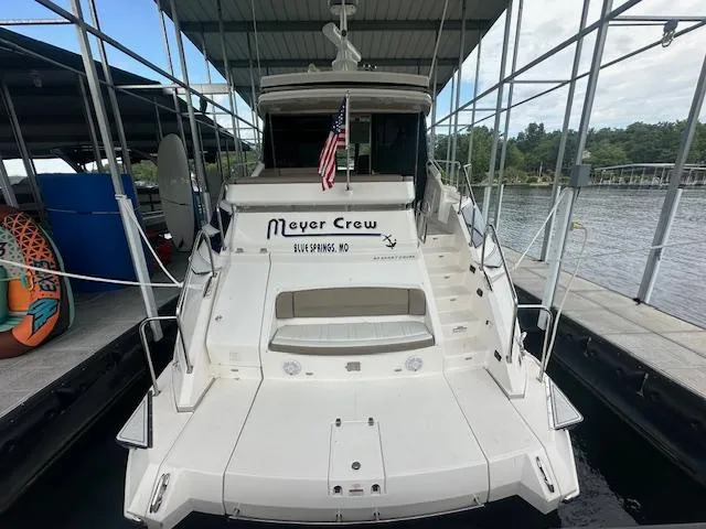Slide: The Image of 2017 Regal 53 Sport Coupe docked, rear view with American flag and "Meyer Crew" signage. - 10