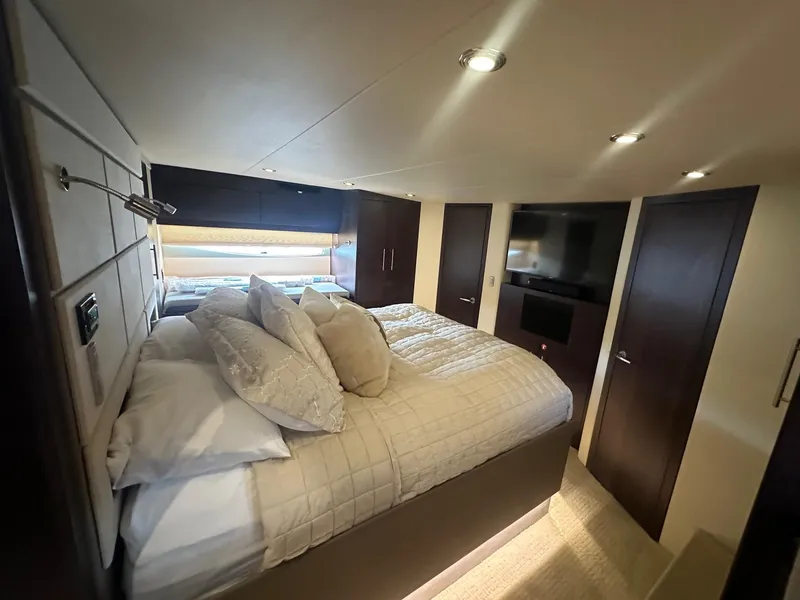 Slide: The Image of Luxurious bedroom interior of 2017 Regal 53 Sport Coupe yacht with cozy bedding and modern design. - 21
