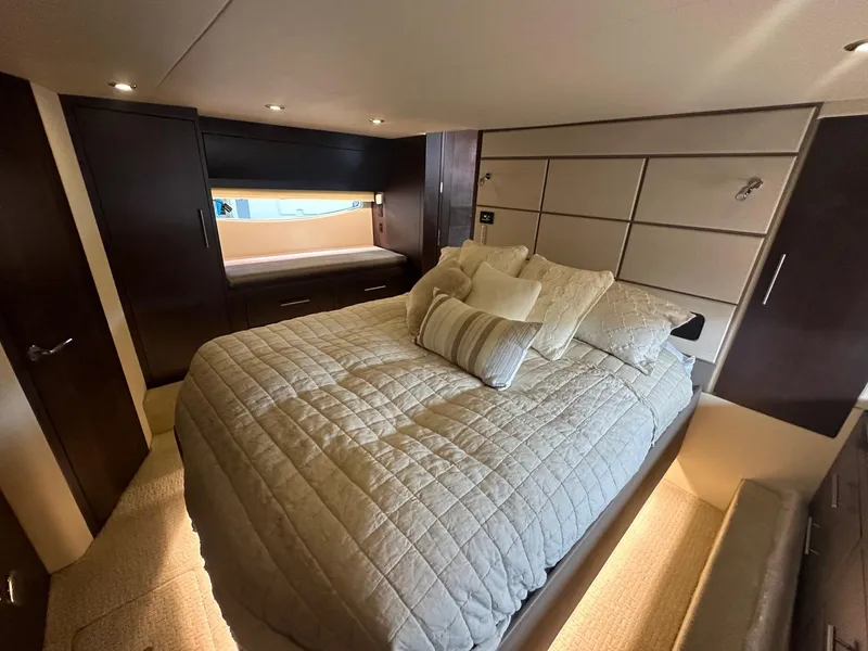 Slide: The Image of Luxurious bedroom interior of 2017 Regal 53 Sport Coupe yacht with elegant bedding. - 22
