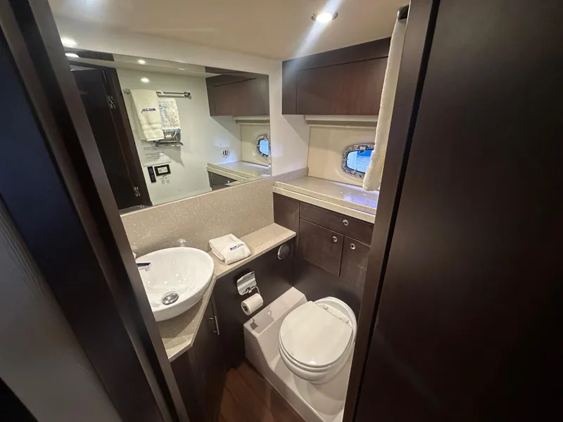 Slide: The Image of Luxurious bathroom interior of 2017 Regal 53 Sport Coupe yacht, featuring modern fixtures and elegant design. - 26