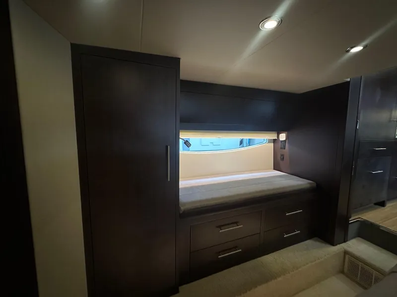 Slide: The Image of Interior cabin of 2017 Regal 53 Sport Coupe yacht with bed and storage. - 28